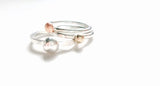 stacking silver rings with gold pebbles
