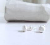 White studs sterling silver earrings, faceted pebbles round