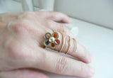 I wear a Flower Around my Finger, 14 k gold, red, yellow, orange, purple resin by Stilosissima, California
